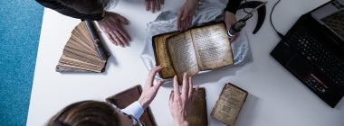 UUֱ researchers look at books the Thomas Fisher Rare Book Library